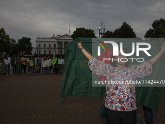 Rokeya Hashi, a Bangladeshi demonstrator, is posing for a photograph during a rally in front of the White House, Washington DC, USA, on July...