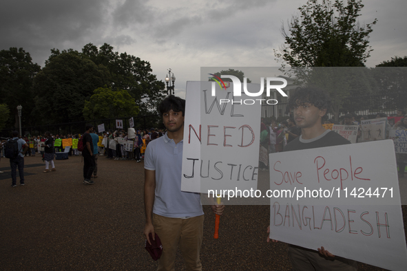 Demonstrators of the Bangladeshi community are displaying signs with the words ''Save people in Bangladesh'' among other informative texts d...