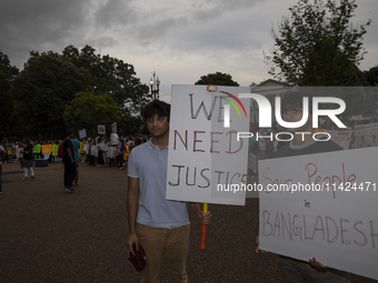 Demonstrators of the Bangladeshi community are displaying signs with the words ''Save people in Bangladesh'' among other informative texts d...