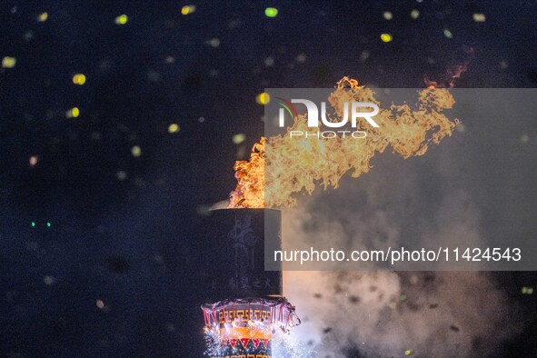 The fire tower of the opening ceremony is being lit on the Asilisi grassland in Hezhang county, Bijie, China, on July 20, 2024. 