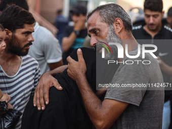 Relatives of the Palestinians, who are dying in Israeli attacks, are mourning at Al-Aqsa Martyr's Hospital in Deir al-Balah, Gaza, on July 2...