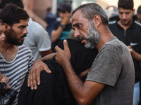 Relatives of the Palestinians, who are dying in Israeli attacks, are mourning at Al-Aqsa Martyr's Hospital in Deir al-Balah, Gaza, on July 2...