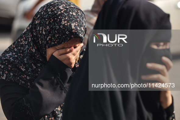 Relatives of the Palestinians, who are dying in Israeli attacks, are mourning at Al-Aqsa Martyr's Hospital in Deir al-Balah, Gaza, on July 2...