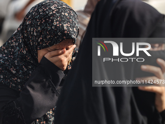 Relatives of the Palestinians, who are dying in Israeli attacks, are mourning at Al-Aqsa Martyr's Hospital in Deir al-Balah, Gaza, on July 2...