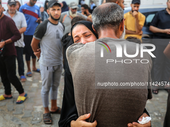 Relatives of the Palestinians, who are dying in Israeli attacks, are mourning at Al-Aqsa Martyr's Hospital in Deir al-Balah, Gaza, on July 2...