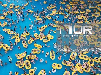 A large number of tourists are cooling off at a water park in Hangzhou, China, on July 21, 2024. (