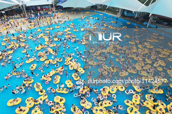 A large number of tourists are cooling off at a water park in Hangzhou, China, on July 21, 2024. 