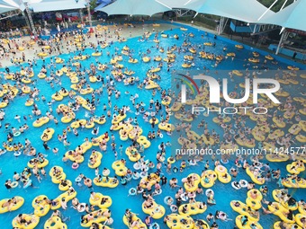 A large number of tourists are cooling off at a water park in Hangzhou, China, on July 21, 2024. (