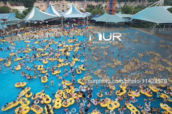 A large number of tourists are cooling off at a water park in Hangzhou, China, on July 21, 2024. 