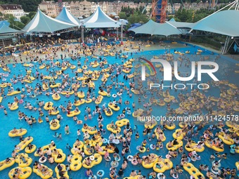 A large number of tourists are cooling off at a water park in Hangzhou, China, on July 21, 2024. (