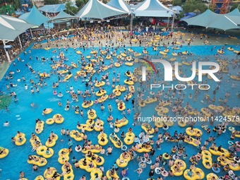 A large number of tourists are cooling off at a water park in Hangzhou, China, on July 21, 2024. (