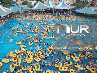 A large number of tourists are cooling off at a water park in Hangzhou, China, on July 21, 2024. (