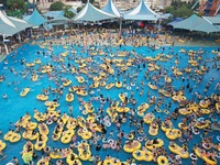 A large number of tourists are cooling off at a water park in Hangzhou, China, on July 21, 2024. (