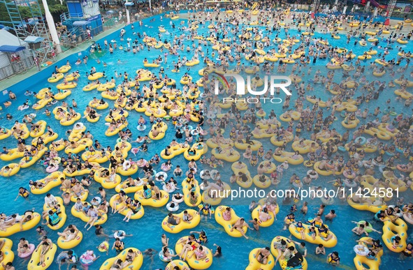 A large number of tourists are cooling off at a water park in Hangzhou, China, on July 21, 2024. 