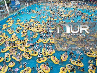 A large number of tourists are cooling off at a water park in Hangzhou, China, on July 21, 2024. (