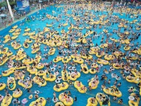 A large number of tourists are cooling off at a water park in Hangzhou, China, on July 21, 2024. (