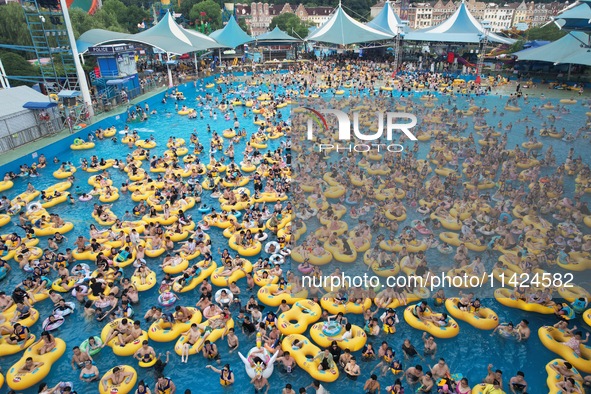 A large number of tourists are cooling off at a water park in Hangzhou, China, on July 21, 2024. 