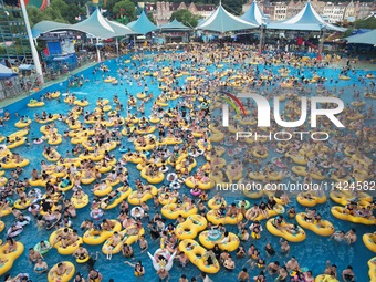 A large number of tourists are cooling off at a water park in Hangzhou, China, on July 21, 2024. (