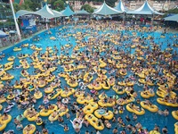 A large number of tourists are cooling off at a water park in Hangzhou, China, on July 21, 2024. (