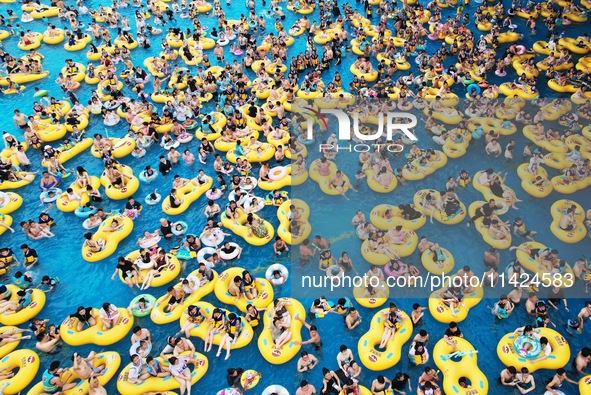 A large number of tourists are cooling off at a water park in Hangzhou, China, on July 21, 2024. 