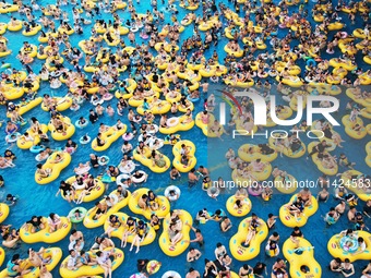 A large number of tourists are cooling off at a water park in Hangzhou, China, on July 21, 2024. (