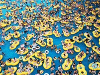 A large number of tourists are cooling off at a water park in Hangzhou, China, on July 21, 2024. (