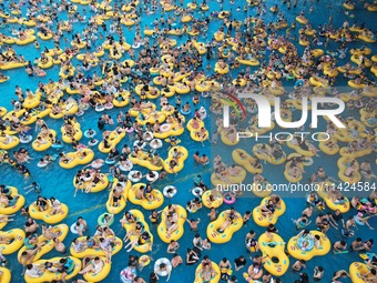 A large number of tourists are cooling off at a water park in Hangzhou, China, on July 21, 2024. (