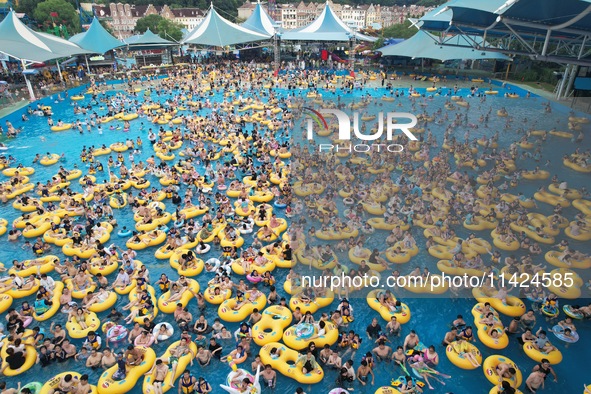 A large number of tourists are cooling off at a water park in Hangzhou, China, on July 21, 2024. 