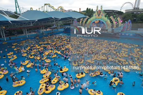 A large number of tourists are cooling off at a water park in Hangzhou, China, on July 21, 2024. 