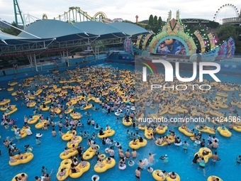 A large number of tourists are cooling off at a water park in Hangzhou, China, on July 21, 2024. (