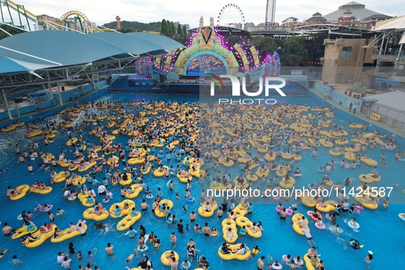 A large number of tourists are cooling off at a water park in Hangzhou, China, on July 21, 2024. 