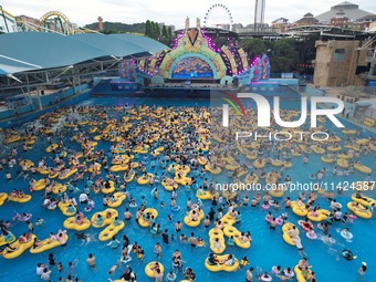 A large number of tourists are cooling off at a water park in Hangzhou, China, on July 21, 2024. (