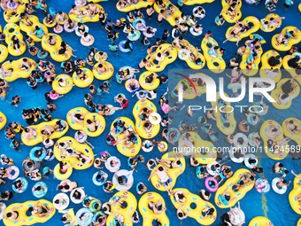 A large number of tourists are cooling off at a water park in Hangzhou, China, on July 21, 2024. (