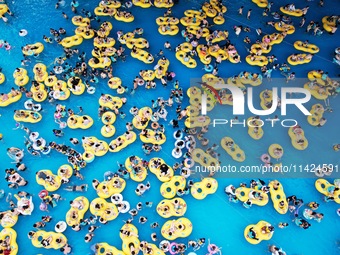 A large number of tourists are cooling off at a water park in Hangzhou, China, on July 21, 2024. (