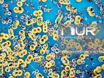 A large number of tourists are cooling off at a water park in Hangzhou, China, on July 21, 2024. (