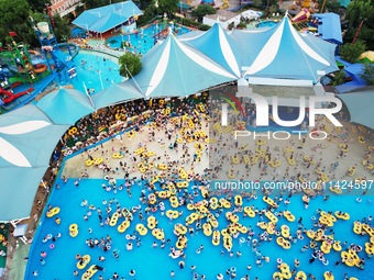 A large number of tourists are cooling off at a water park in Hangzhou, China, on July 21, 2024. (