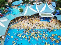 A large number of tourists are cooling off at a water park in Hangzhou, China, on July 21, 2024. (