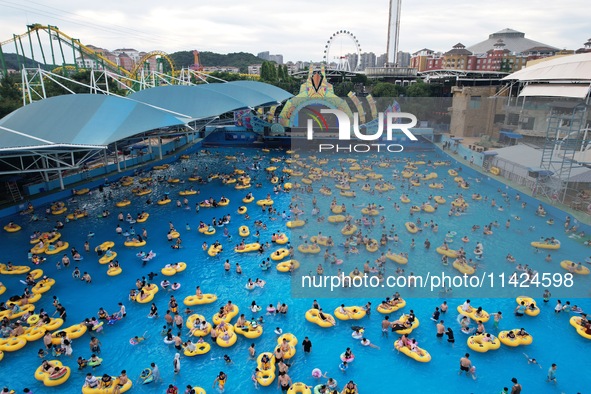 A large number of tourists are cooling off at a water park in Hangzhou, China, on July 21, 2024. 