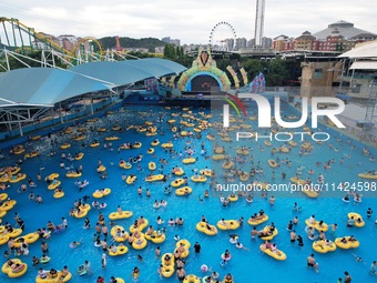 A large number of tourists are cooling off at a water park in Hangzhou, China, on July 21, 2024. (