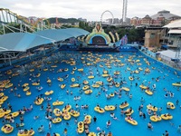 A large number of tourists are cooling off at a water park in Hangzhou, China, on July 21, 2024. (