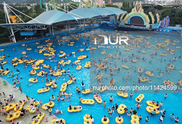 A large number of tourists are cooling off at a water park in Hangzhou, China, on July 21, 2024. 