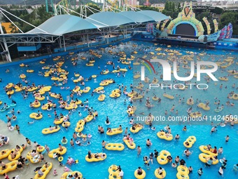 A large number of tourists are cooling off at a water park in Hangzhou, China, on July 21, 2024. (