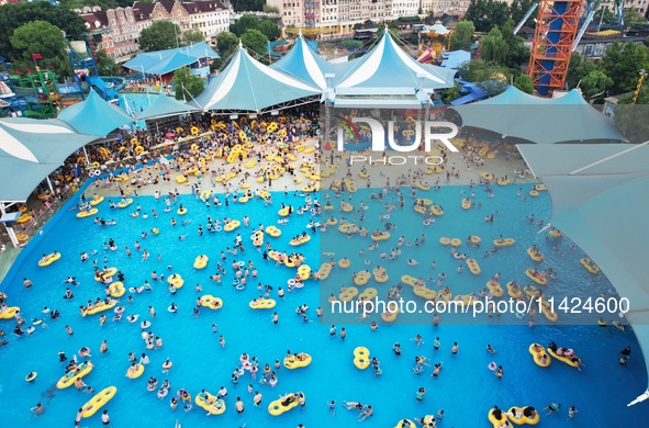 A large number of tourists are cooling off at a water park in Hangzhou, China, on July 21, 2024. 