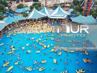 A large number of tourists are cooling off at a water park in Hangzhou, China, on July 21, 2024. (