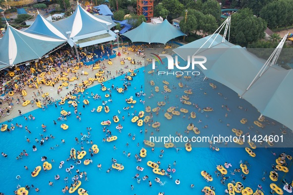 A large number of tourists are cooling off at a water park in Hangzhou, China, on July 21, 2024. 