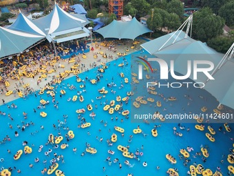 A large number of tourists are cooling off at a water park in Hangzhou, China, on July 21, 2024. (