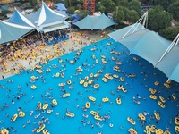 A large number of tourists are cooling off at a water park in Hangzhou, China, on July 21, 2024. (