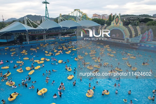 A large number of tourists are cooling off at a water park in Hangzhou, China, on July 21, 2024. 