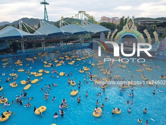 A large number of tourists are cooling off at a water park in Hangzhou, China, on July 21, 2024. (