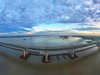 The steel deck pavement of the main channel bridge of the Changtai Yangtze River Bridge is under construction in Taixing, China, on July 21,...